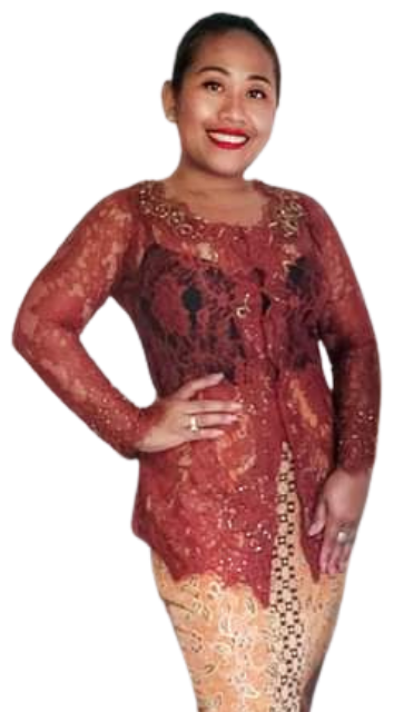 Chef Novy in a terracotta lace kebaya, hand on hip and smiling warmly